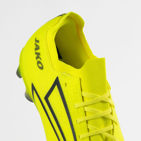 5550_676_P03 Bright yellow high-cut football boot with black side stripes and laced front, viewed from the side.