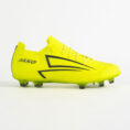 Bright yellow Jako soccer cleat with black geometric side graphic and studs visible underfoot.