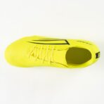Top-down view of a neon yellow athletic shoe with laces, featuring a black logo on the side and a snug sock-like ankle collar.