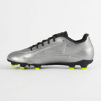 Silver soccer cleat with black laces and neon yellow studs on a black sole, photographed from the side.