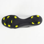 Bottom view of a black soccer cleat with neon yellow studs arranged for firm ground play.
