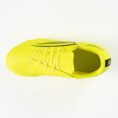Bright yellow running shoe viewed from above, showing laces and a dark side stripe on the upper.