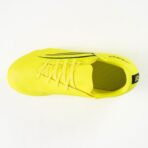 Bright yellow running shoe viewed from above, showing laces and a dark side stripe on the upper.