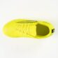 Bright yellow running shoe viewed from above, showing laces and a dark side stripe on the upper.