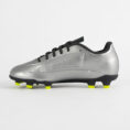 Side view of a silver soccer cleat with black laces and neon yellow studs on the sole.