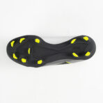 Bottom view of a black athletic cleat with neon yellow studs around the sole for traction.
