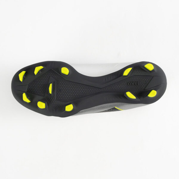 5555_677_P05 Bottom view of a black athletic cleat with neon yellow studs around the sole for traction.