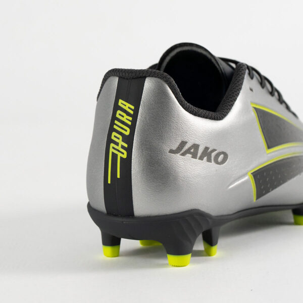 5555_677_P06 Rear view of a silver soccer cleat with neon yellow accents and the Jako logo on the heel area.